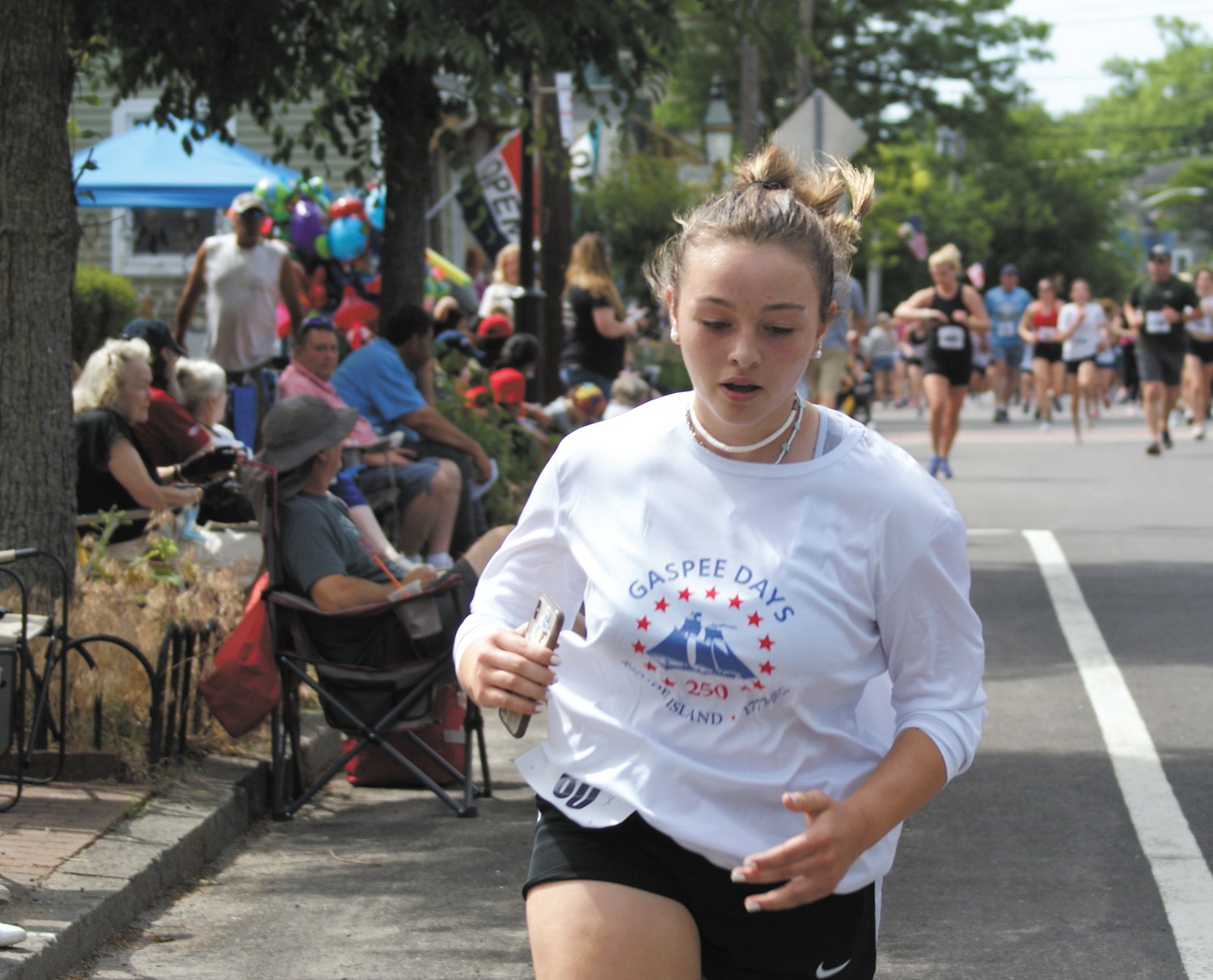 GIVING IT ALL: High School freshman Rachel Popiel from Sterling, Connecticut, digs deep and pushes the final quarter mile. (Photo by Steve Popiel)